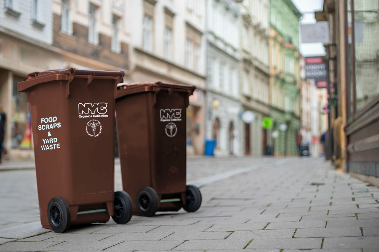 two brown waste bins for compost at the curb of a city street